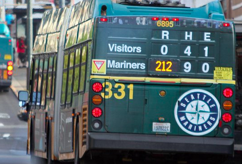 bus ad where bus number forms part of imaginary baseball scoreboard