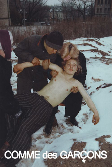 Half-naked, comotose guy in Comme Des Garcon pants being dragged thru snow