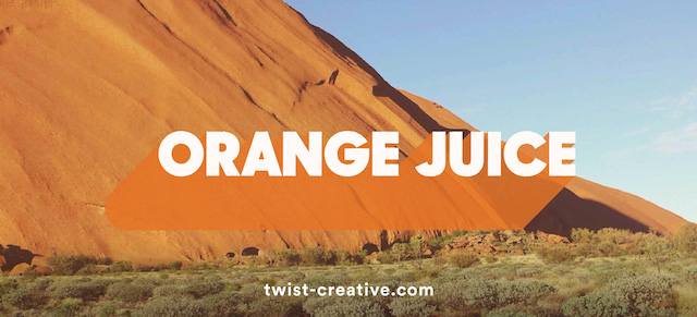 The words 'orange juice' on a scenic background