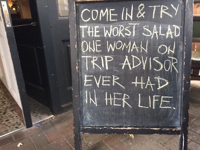 Sign: come in & try the worst salad one woman on trip advisor ever had in her life