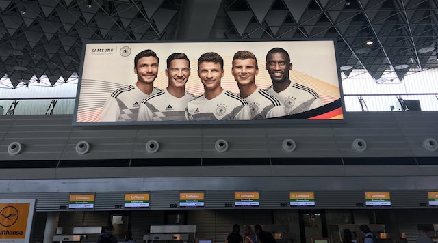 German team on outdoor ad at airport